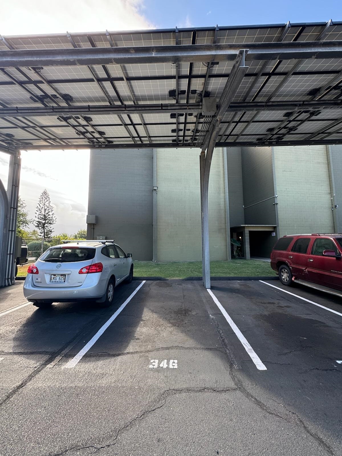 111 Kahului Beach Road, Unit B213 Kahului, HI 96732 - Photo 27 of 28 a view of parking garage with cars parked