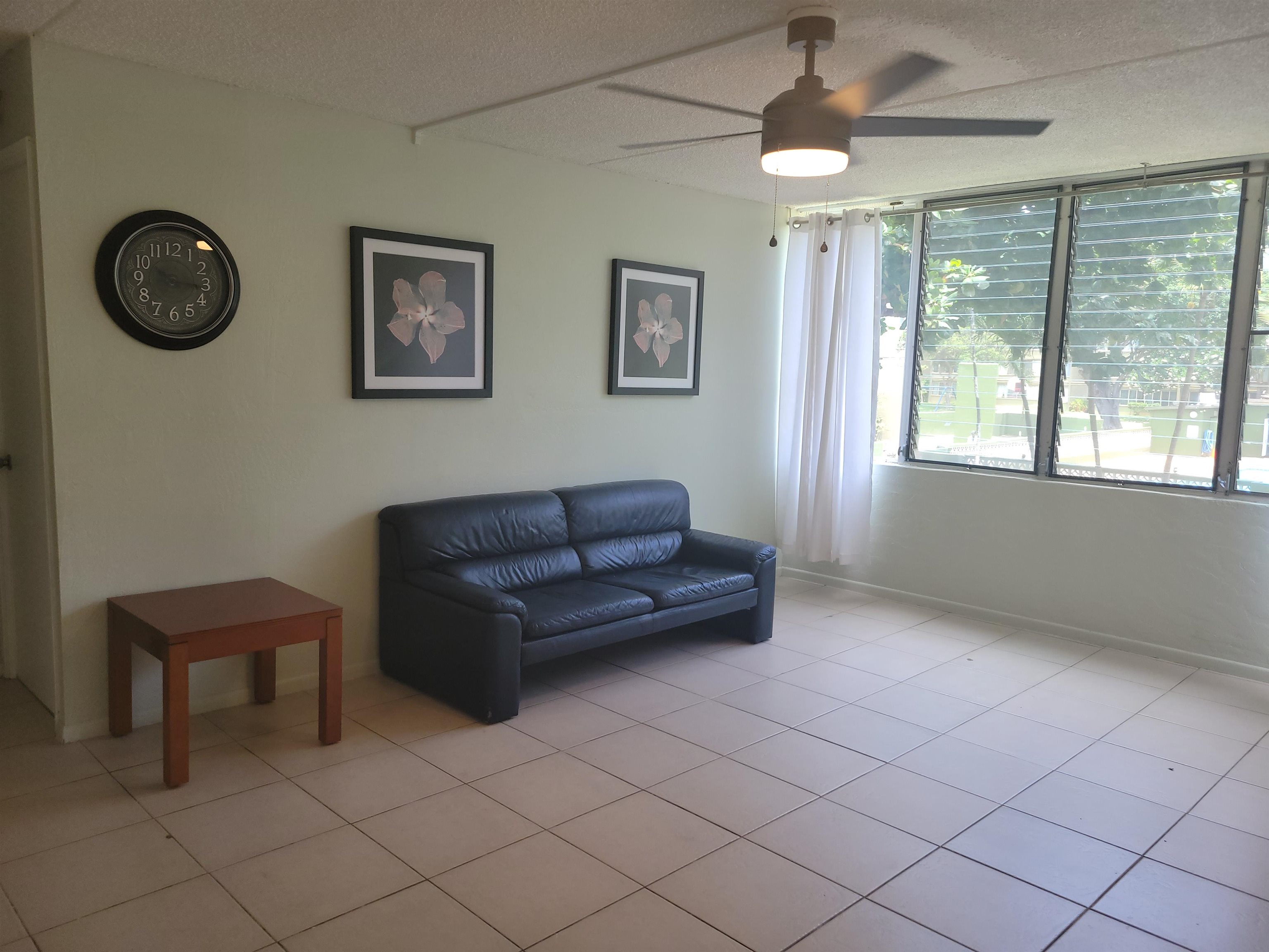 111 Kahului Beach Road, Unit B213 Kahului, HI 96732 - Photo 7 of 28 a living room with furniture and a window