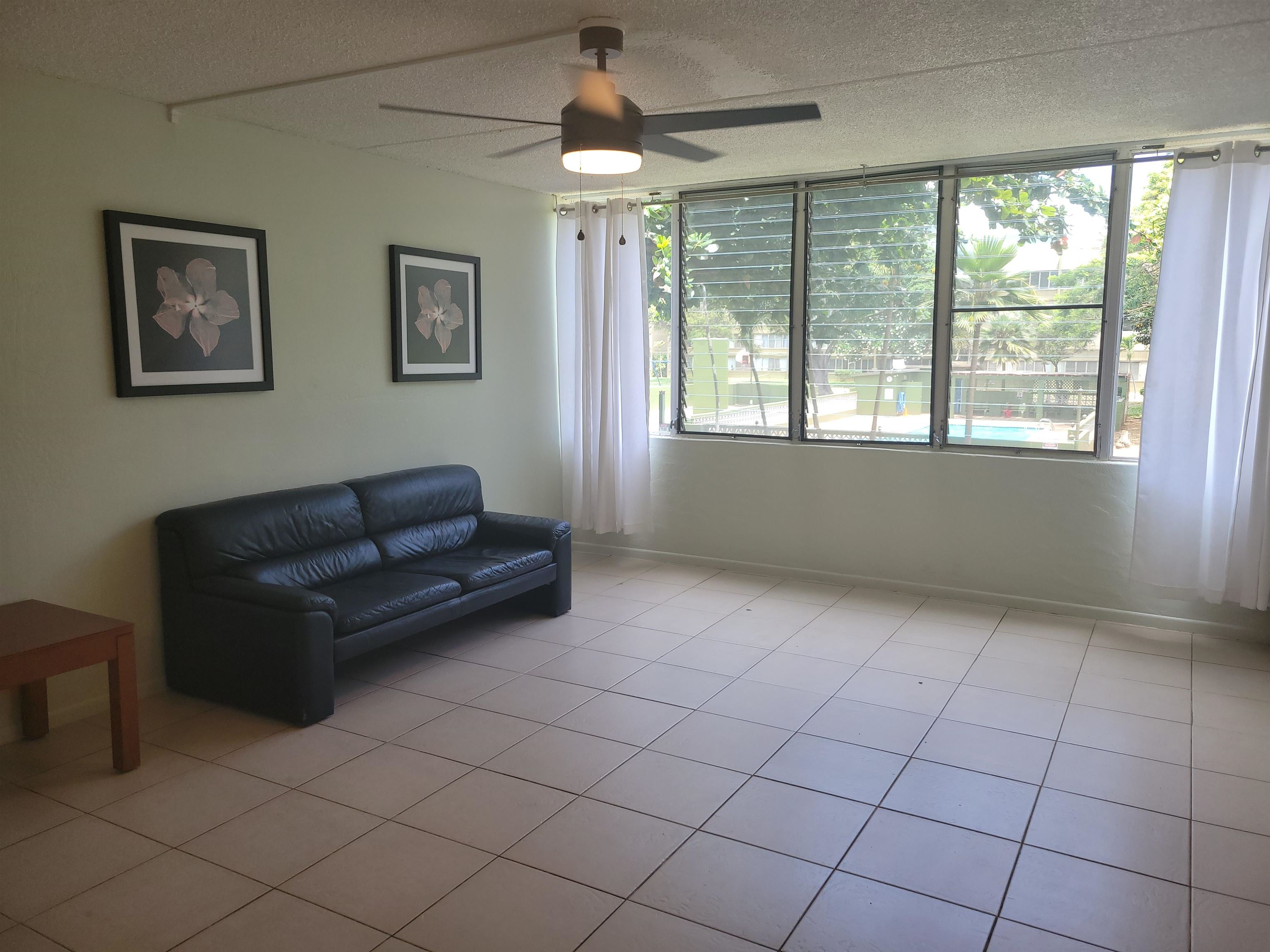 111 Kahului Beach Road, Unit B213 Kahului, HI 96732 - Photo 8 of 28 a living room with furniture and a large window