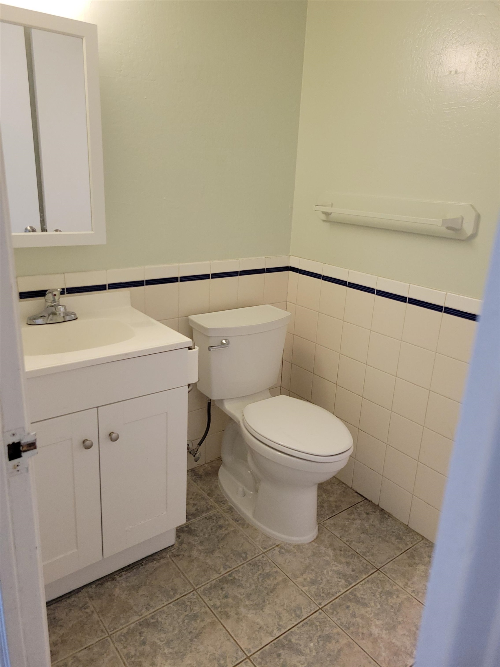 111 Kahului Beach Road, Unit B213 Kahului, HI 96732 - Photo 9 of 28 a bathroom with a toilet sink and mirror