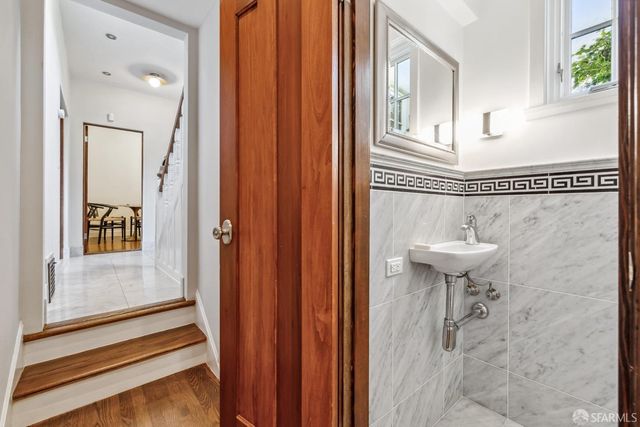 a view of a dining room with furniture and a wooden floor