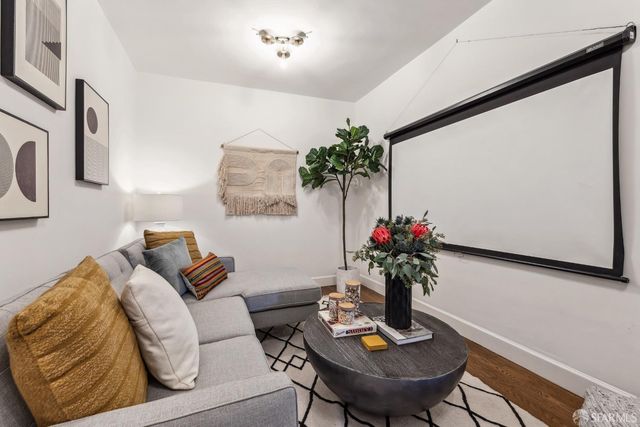 a dining room with furniture and wooden floor