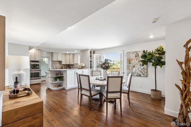 a view of sitting area with furniture on wooden deck