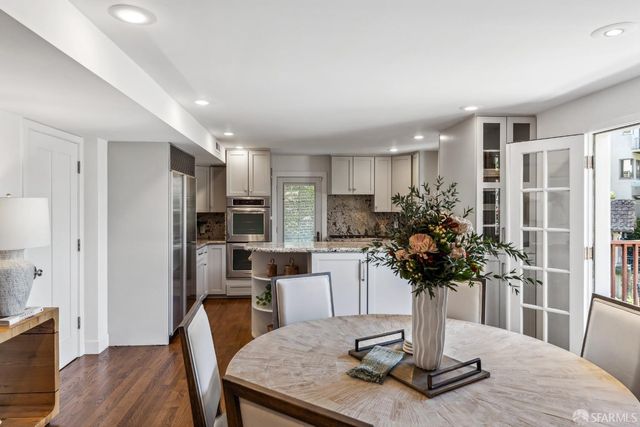 an aerial view of a house with yard