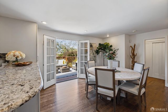 a view of a patio with couches chairs and a potted plant