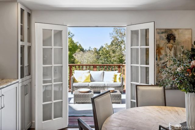 a kitchen with stainless steel appliances kitchen island granite countertop a stove sink and cabinets