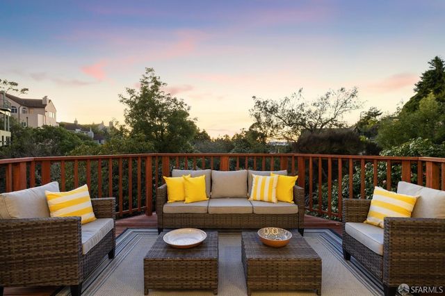 a kitchen with granite countertop a sink a counter space and stainless steel appliances