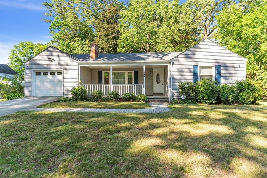 494 Tiffany Street Springfield, MA 01108 - Photo 1 of 40 a front view of a house with a garden