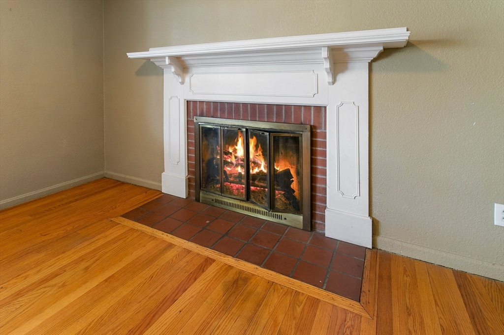 494 Tiffany Street Springfield, MA 01108 - Photo 15 of 40 a view of empty room with window and fireplace