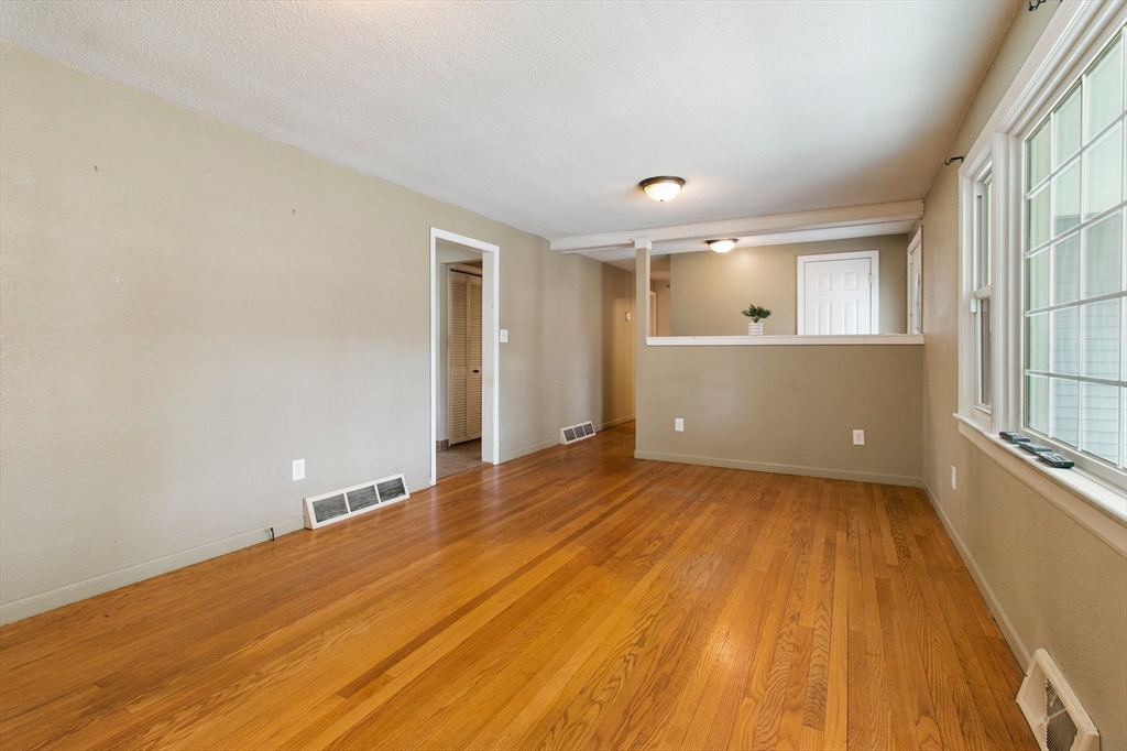 494 Tiffany Street Springfield, MA 01108 - Photo 17 of 40 wooden floor in an empty room with a window