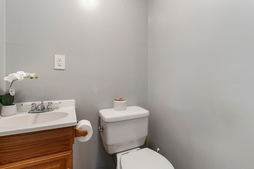 494 Tiffany Street Springfield, MA 01108 - Photo 19 of 40 a white toilet sitting next to a bathroom sink