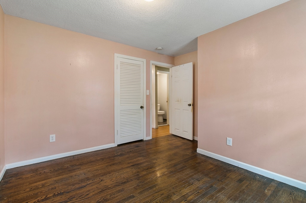 494 Tiffany Street Springfield, MA 01108 - Photo 21 of 40 a view of an empty room with wooden floor