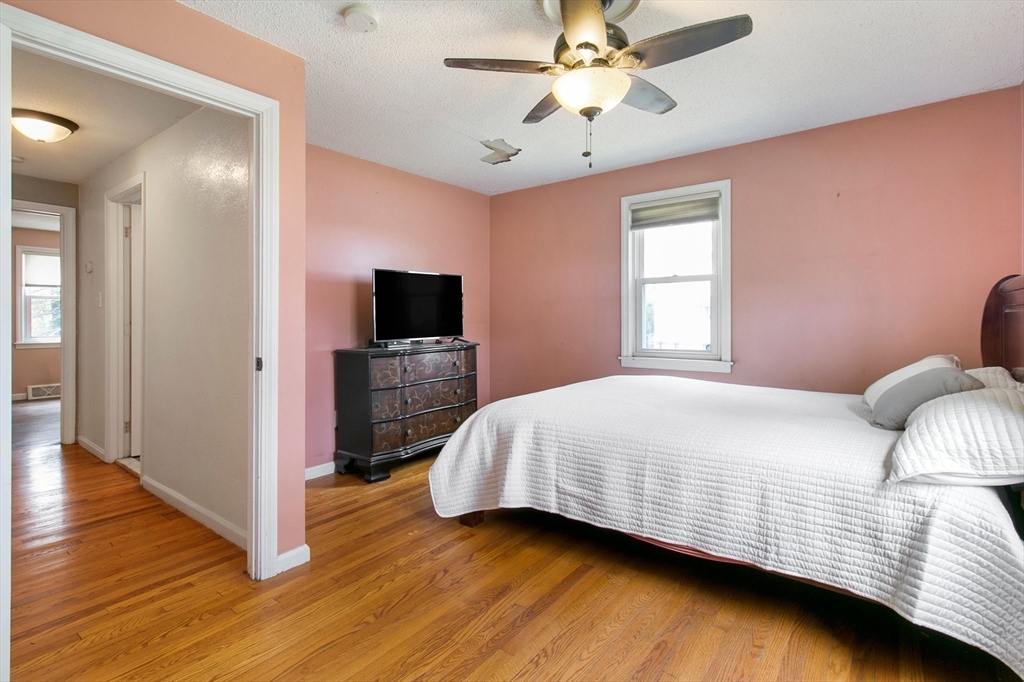 494 Tiffany Street Springfield, MA 01108 - Photo 24 of 40 a bedroom with a bed and a flat screen tv