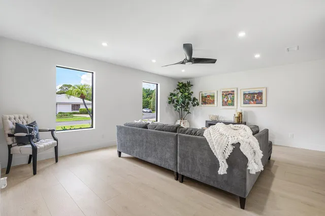 a kitchen with a potted plant on the counter and cabinets