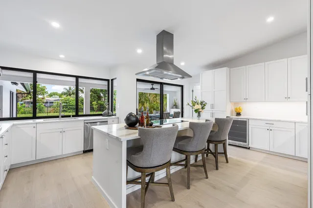 a bedroom with a bed and a ceiling fan