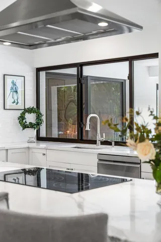 a utility room with sink dryer and washer
