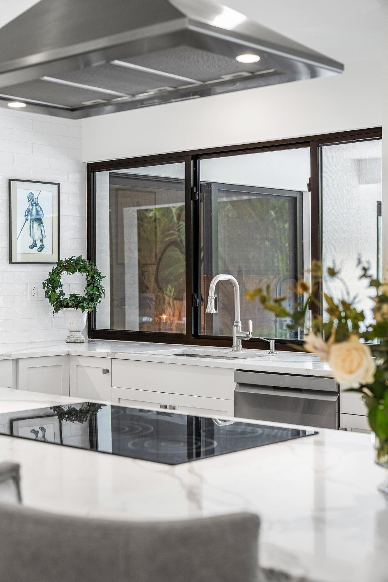 6901 Giralda Circle Boca Raton, FL 33433 - Photo 21 of 83 a living room with granite countertop a couch and fireplace