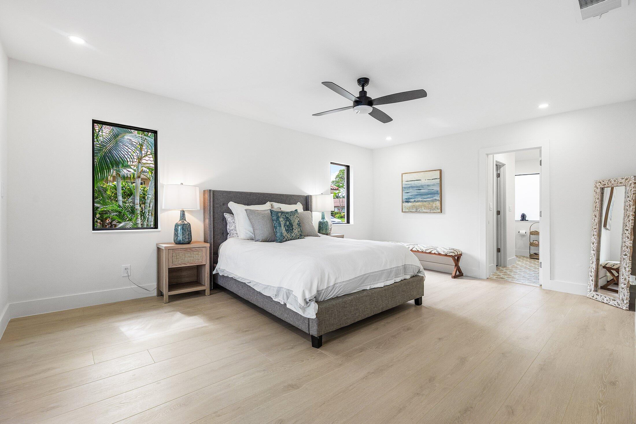 6901 Giralda Circle Boca Raton, FL 33433 - Photo 23 of 83 a bedroom with a bed lamp closet and window