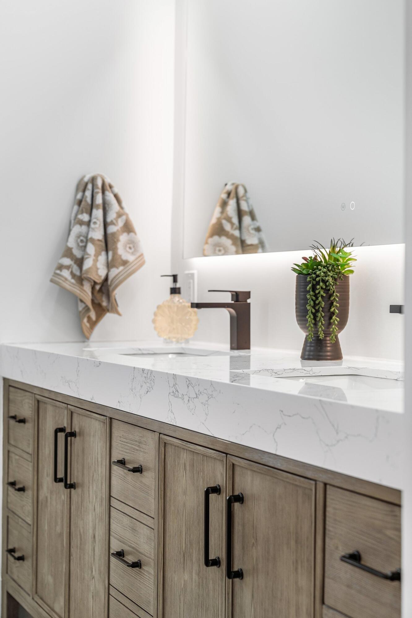 6901 Giralda Circle Boca Raton, FL 33433 - Photo 28 of 83 a kitchen with a potted plant on the counter and cabinets