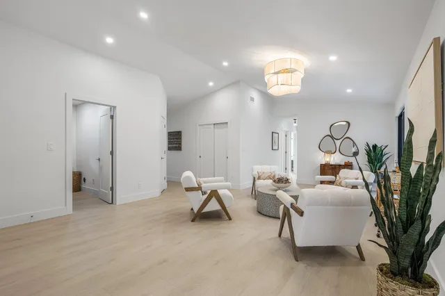 a bedroom with a bed and a ceiling fan