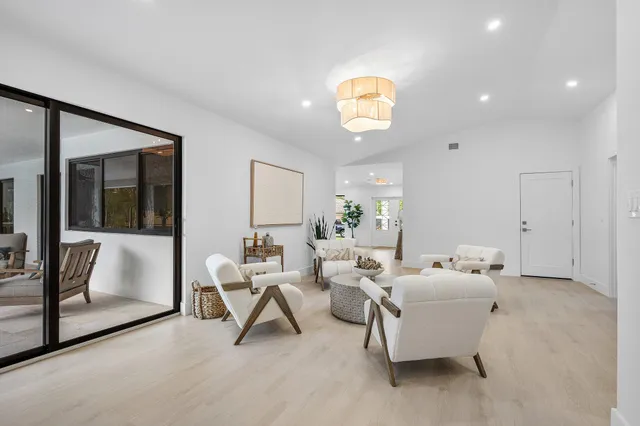 a room with a bed window and a dresser