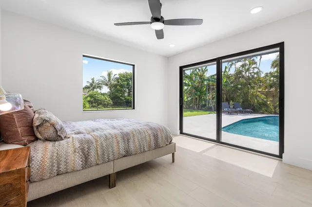 a bedroom with a bed and a night stand