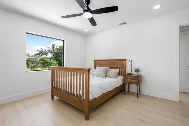 a bathroom with a bathtub a sink and a mirror
