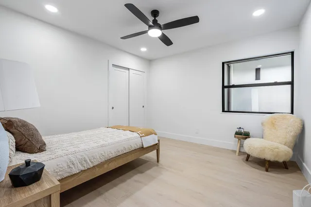 a bathroom with a sink mirror and a shower
