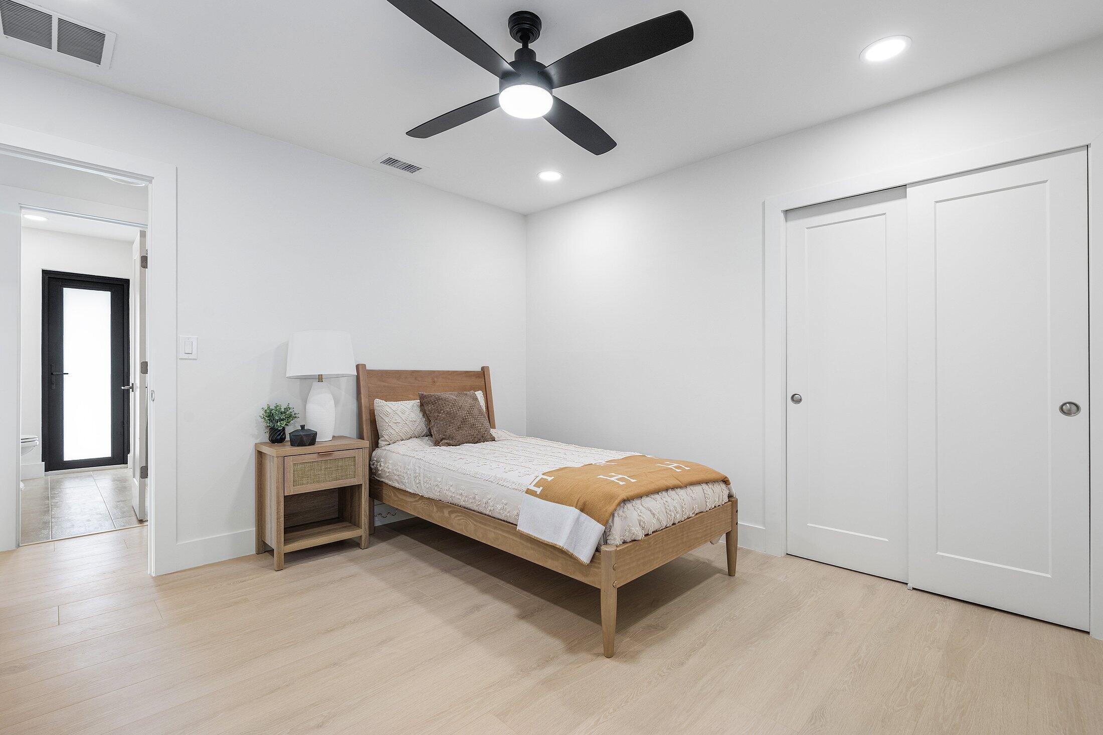 6901 Giralda Circle Boca Raton, FL 33433 - Photo 37 of 83 a bedroom with a bed and a ceiling fan