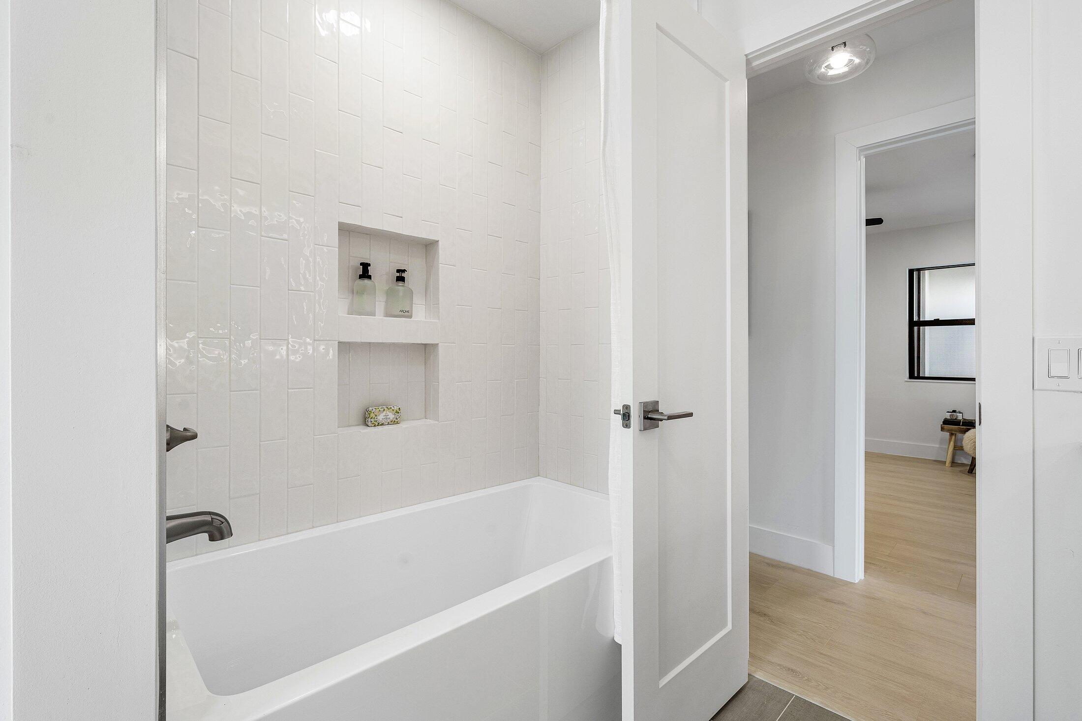 6901 Giralda Circle Boca Raton, FL 33433 - Photo 40 of 83 a white bath tub sitting next to a shower