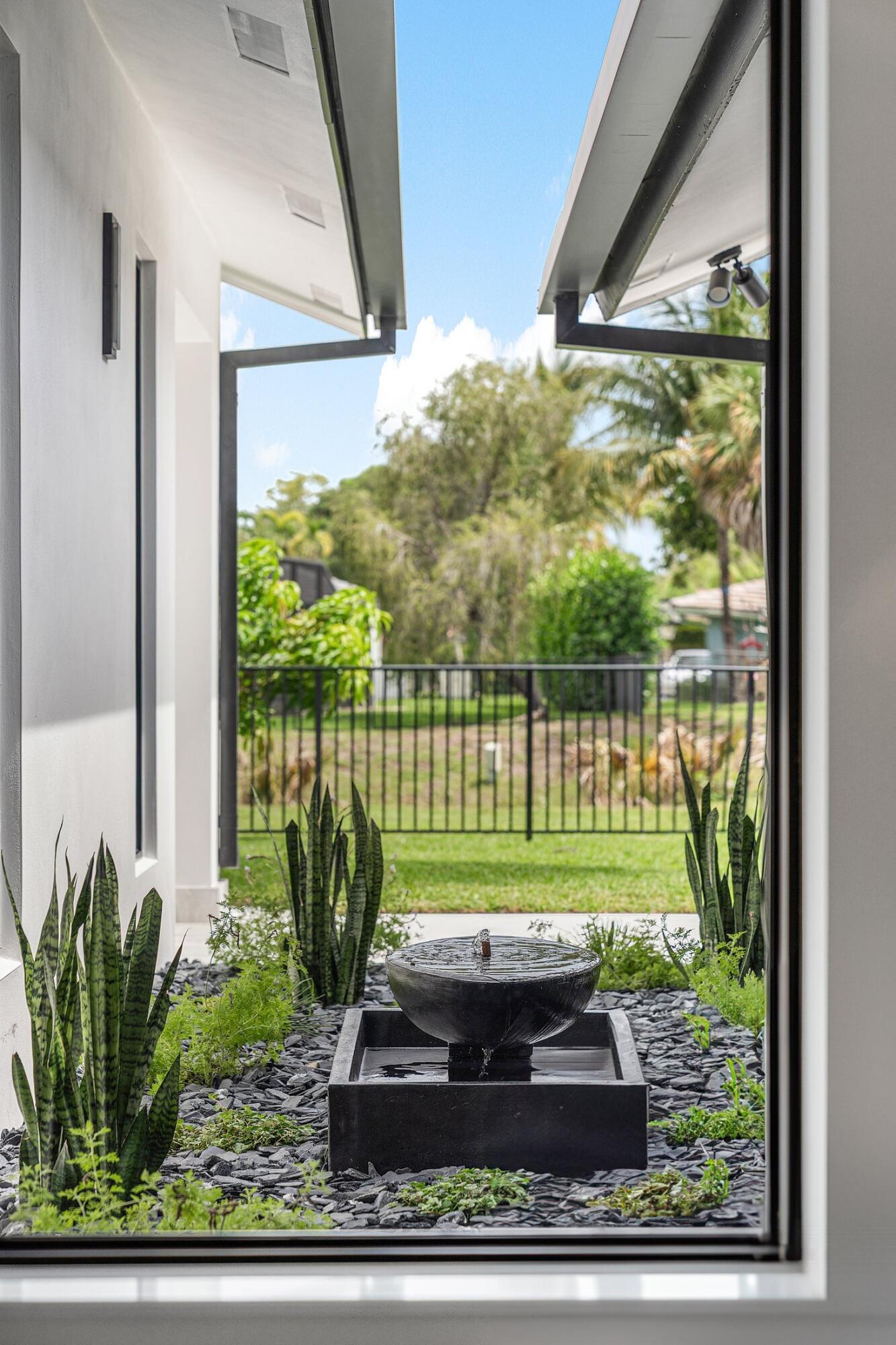 6901 Giralda Circle Boca Raton, FL 33433 - Photo 44 of 83 a view of a porch with a garden