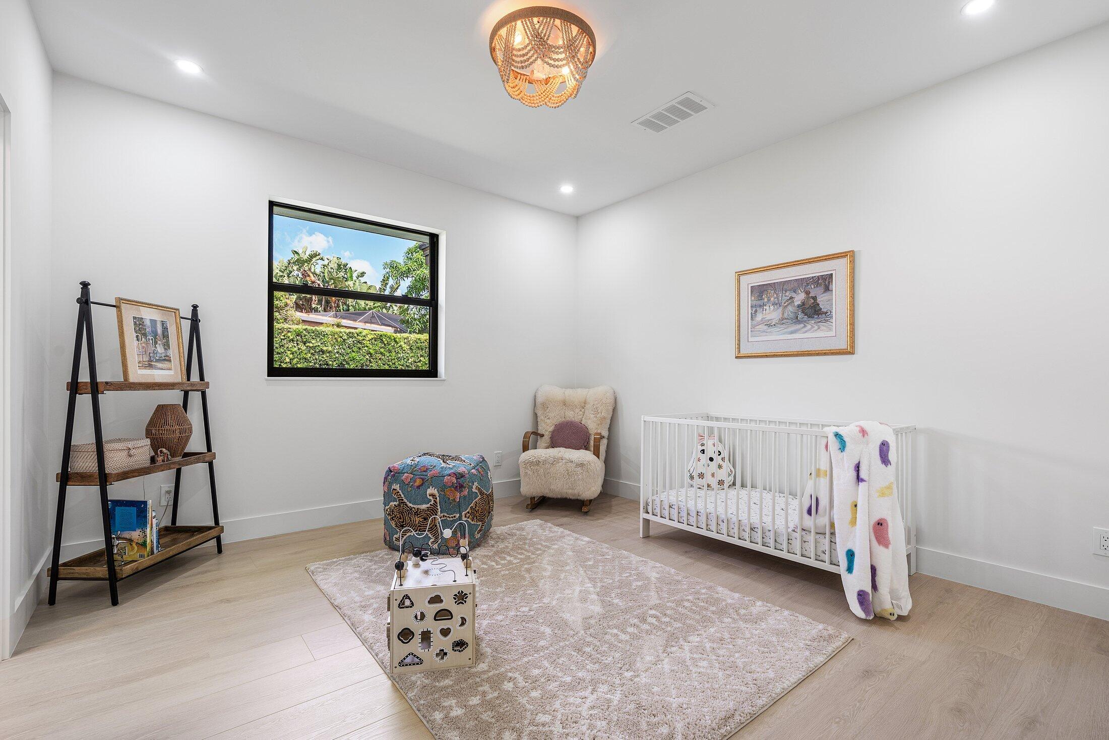 6901 Giralda Circle Boca Raton, FL 33433 - Photo 47 of 83 a bedroom with a bed and a chandelier