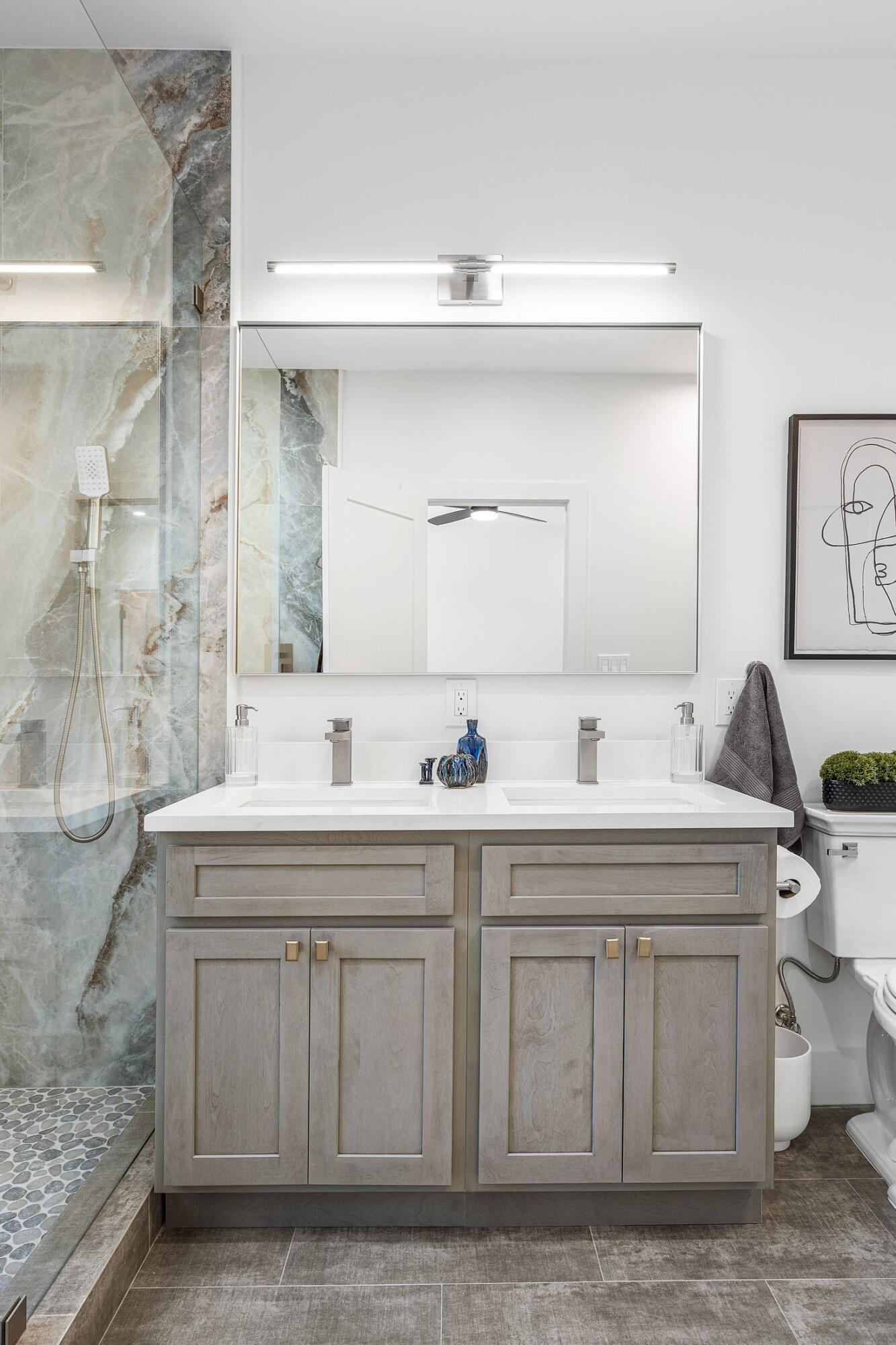 6901 Giralda Circle Boca Raton, FL 33433 - Photo 48 of 83 a bathroom with a sink and a mirror