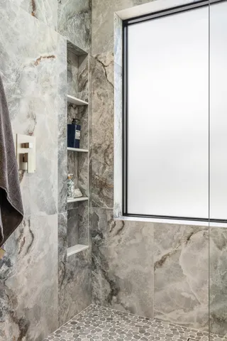 an aerial view of a house with pool