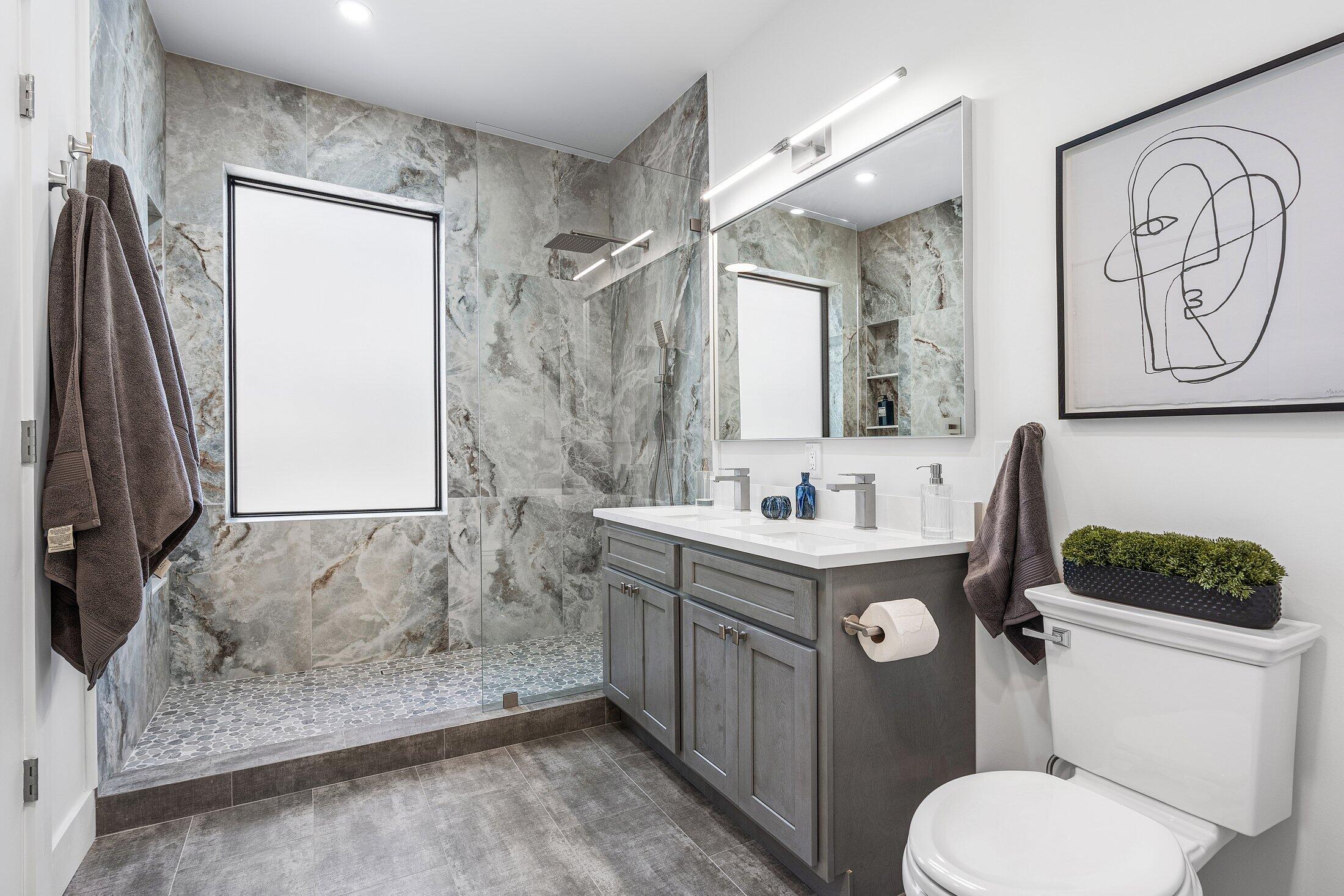 6901 Giralda Circle Boca Raton, FL 33433 - Photo 50 of 83 a bathroom with a toilet sink and mirror