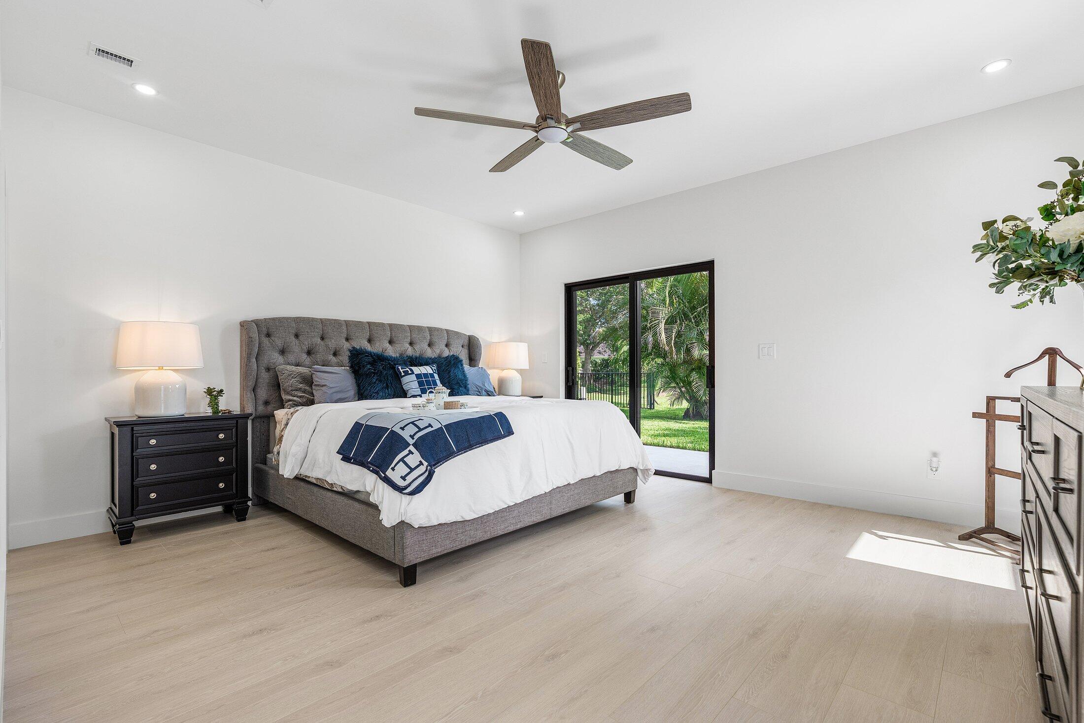 6901 Giralda Circle Boca Raton, FL 33433 - Photo 51 of 83 a bedroom with a bed and window