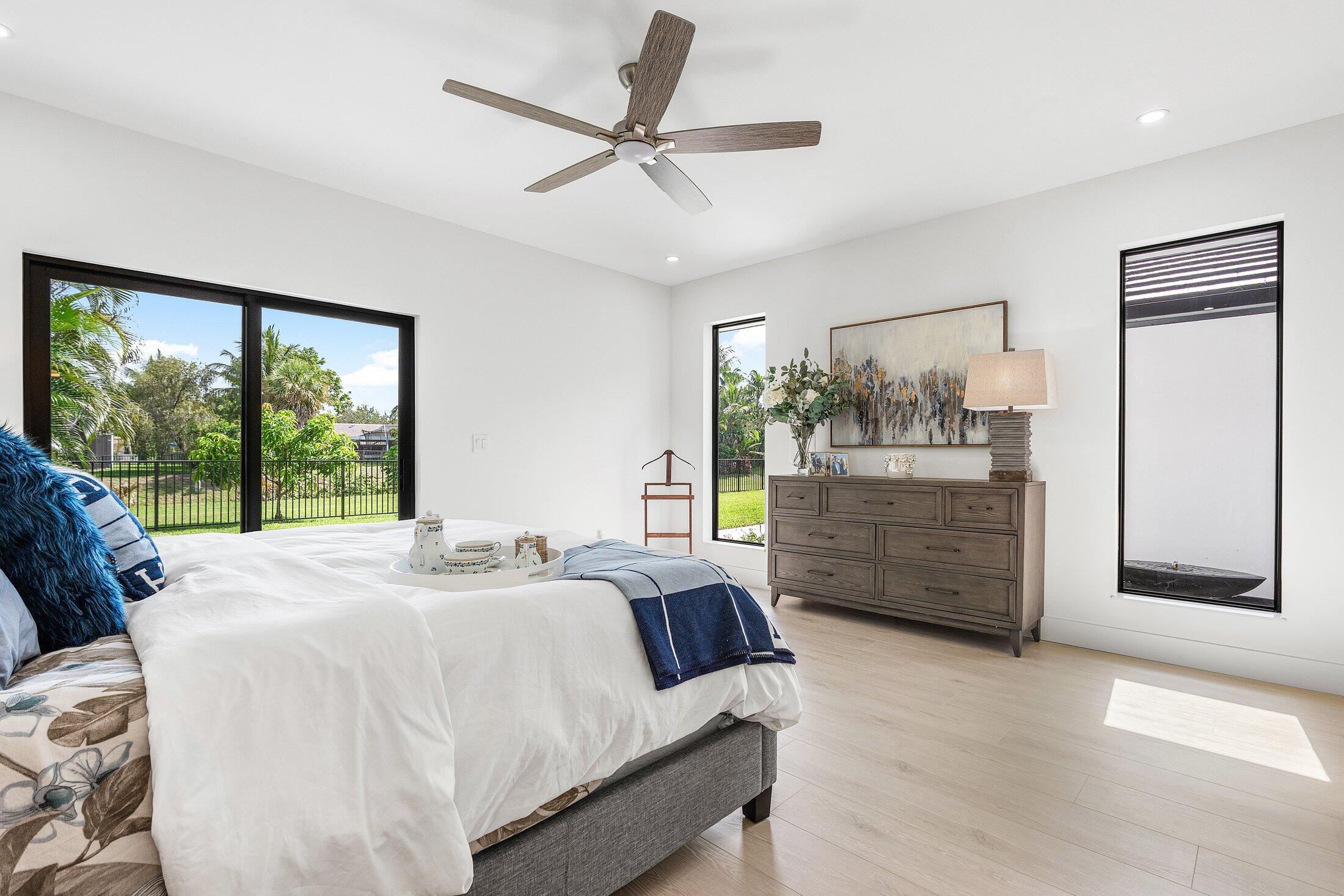 6901 Giralda Circle Boca Raton, FL 33433 - Photo 53 of 83 a room with a bed window and a dresser