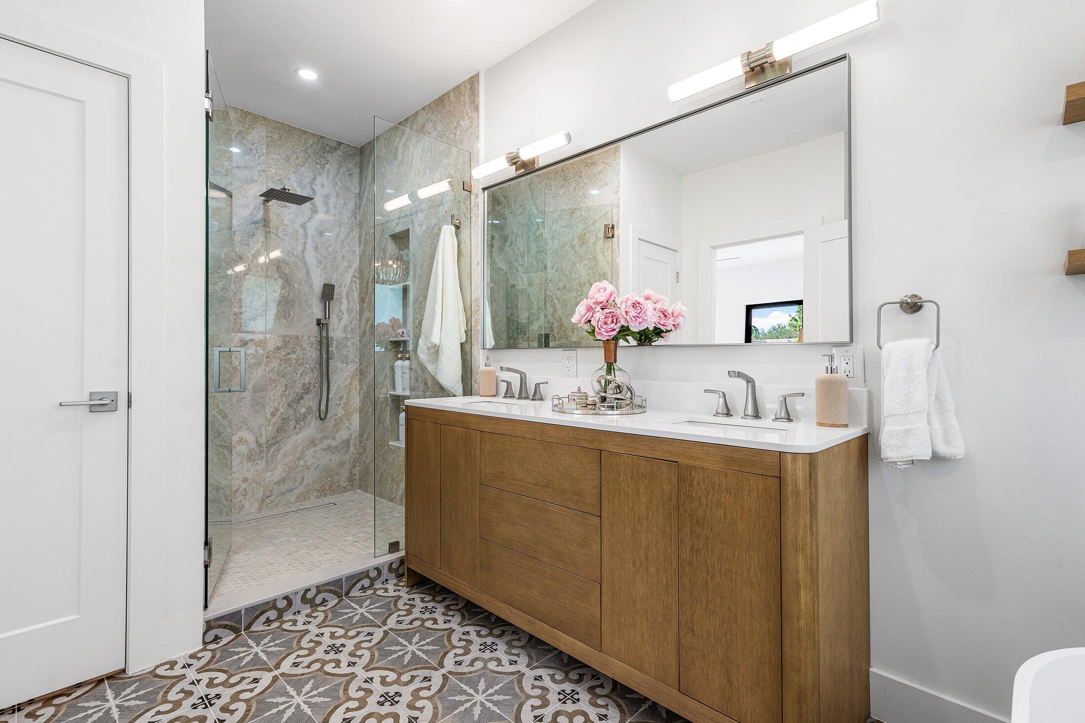 6901 Giralda Circle Boca Raton, FL 33433 - Photo 56 of 83 a bathroom with a granite countertop sink mirror and shower