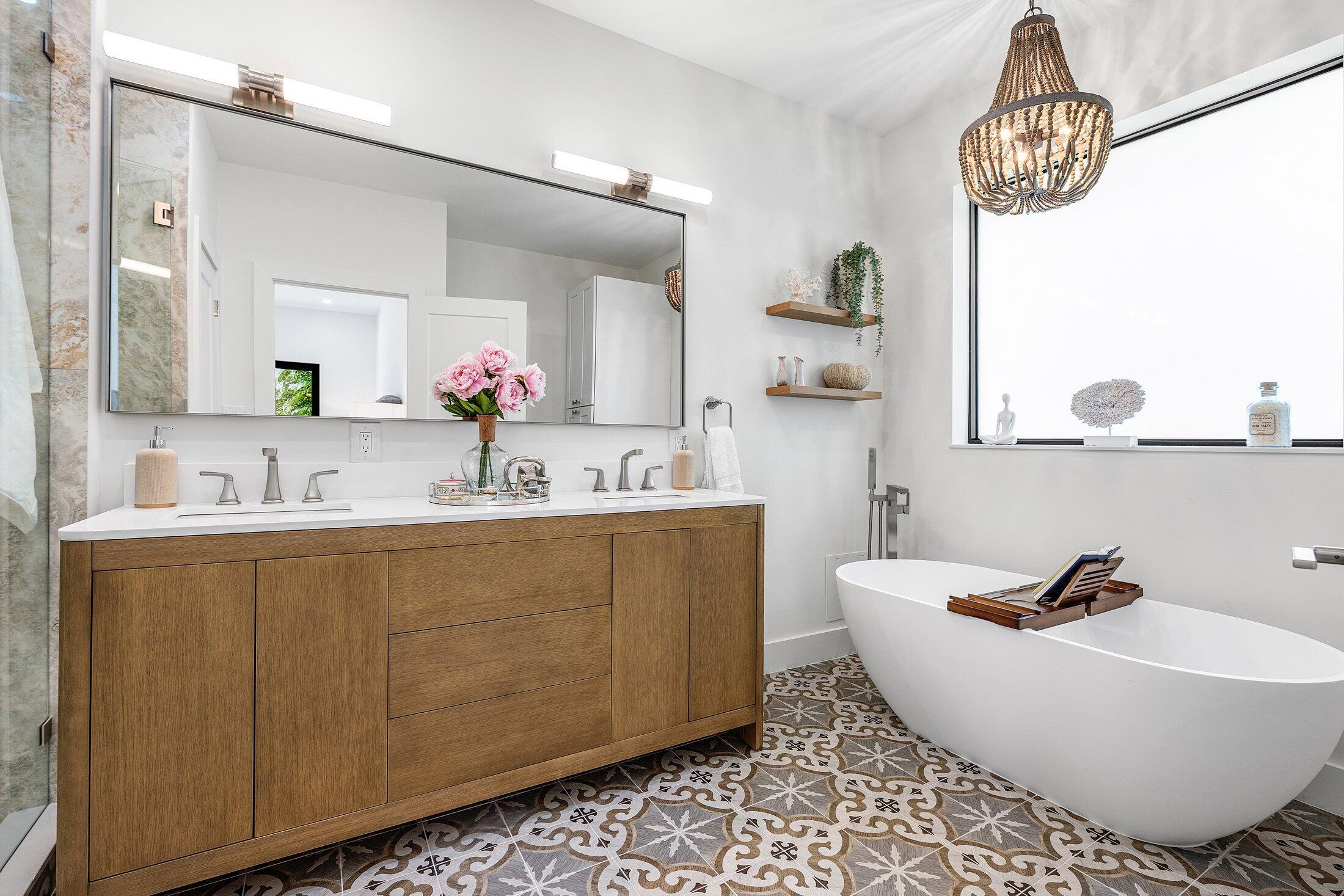 6901 Giralda Circle Boca Raton, FL 33433 - Photo 57 of 83 a bathroom with a bathtub a sink and a mirror