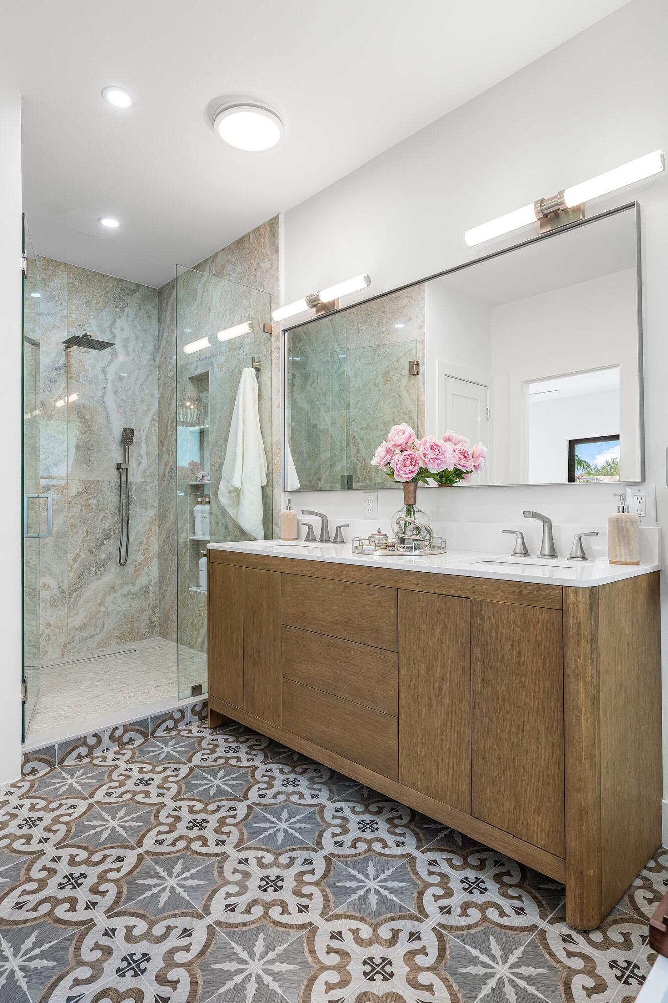 6901 Giralda Circle Boca Raton, FL 33433 - Photo 58 of 83 a bathroom with a sink mirror and a shower