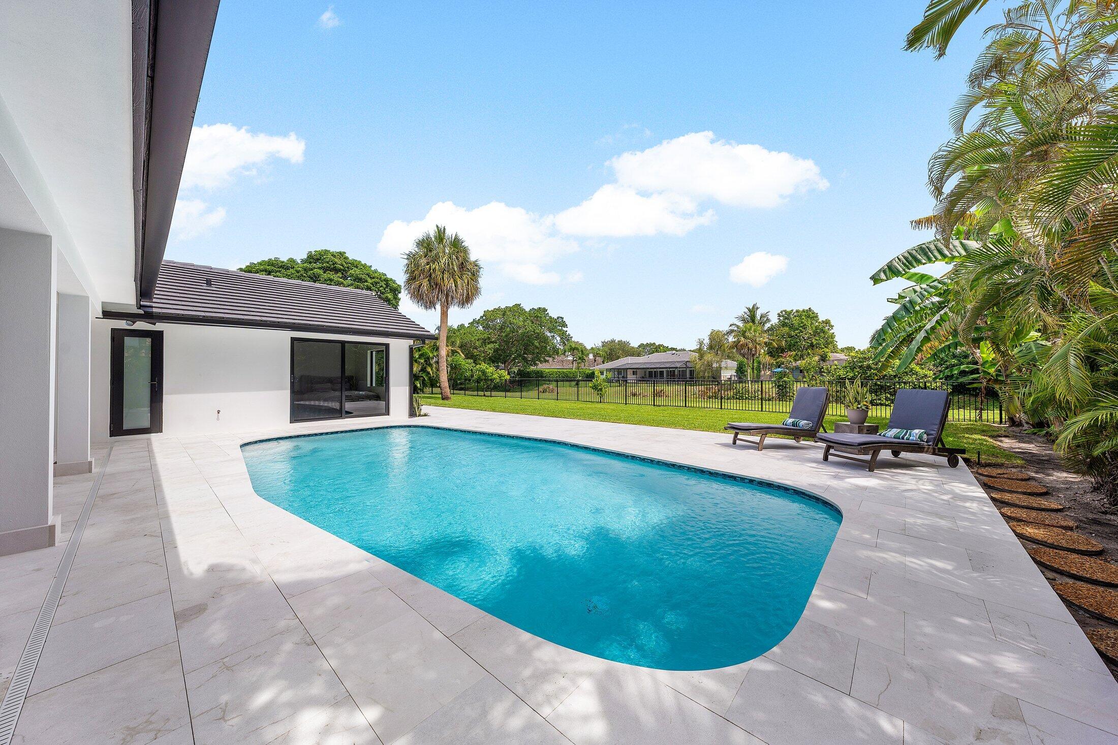 6901 Giralda Circle Boca Raton, FL 33433 - Photo 64 of 83 a view of swimming pool with lounge chair