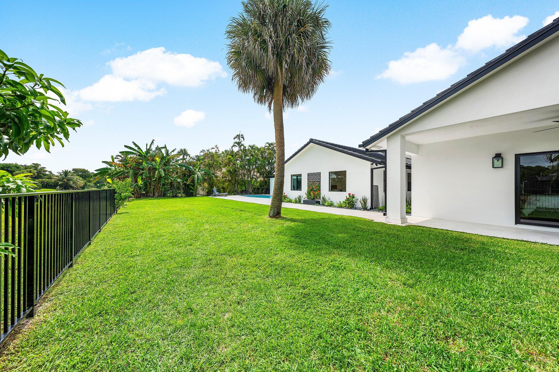 6901 Giralda Circle Boca Raton, FL 33433 - Photo 70 of 83 a view of house with garden and trees