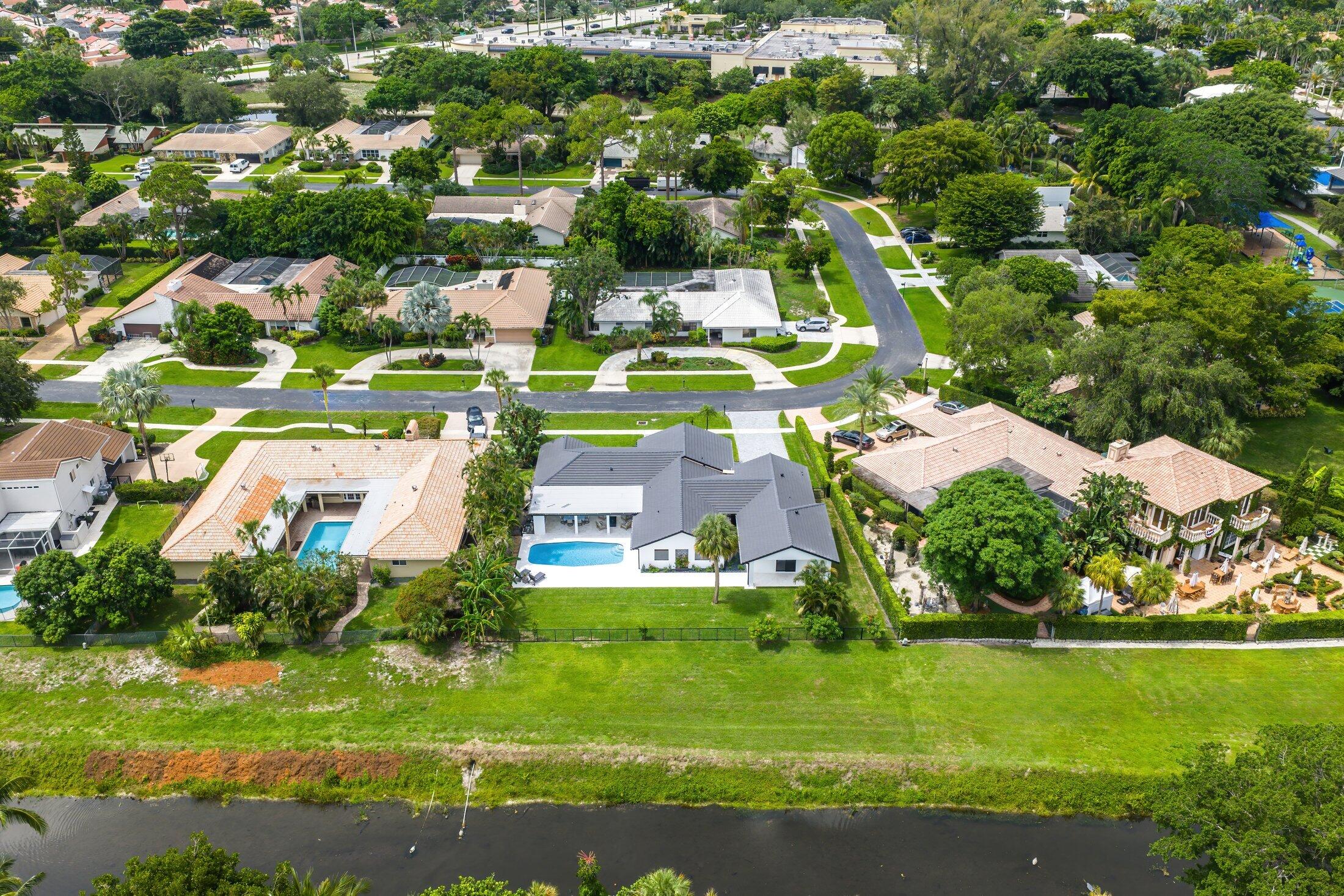6901 Giralda Circle Boca Raton, FL 33433 - Photo 76 of 83 an aerial view of residential houses with outdoor space and trees