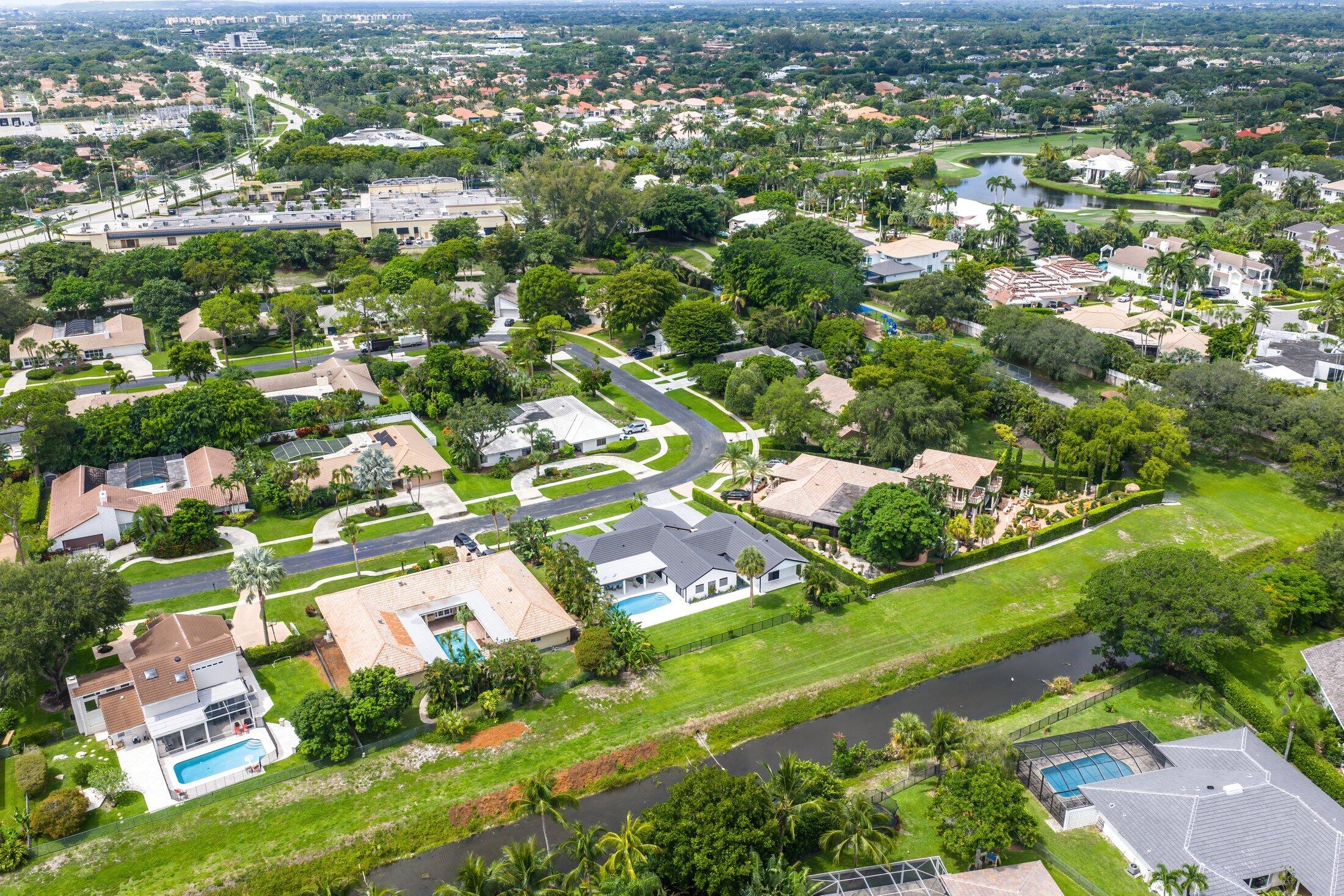 6901 Giralda Circle Boca Raton, FL 33433 - Photo 77 of 83 an aerial view of residential houses with outdoor space and trees