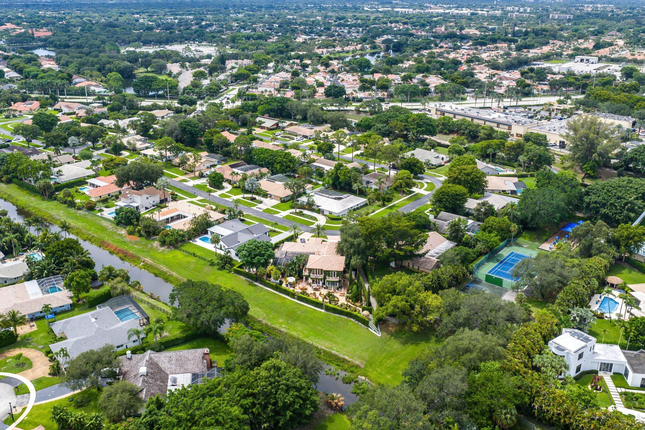 6901 Giralda Circle Boca Raton, FL 33433 - Photo 78 of 83 an aerial view of residential houses with outdoor space and trees