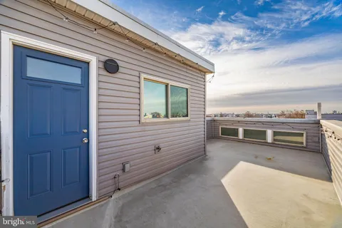 a couple of cars parked in front of a building