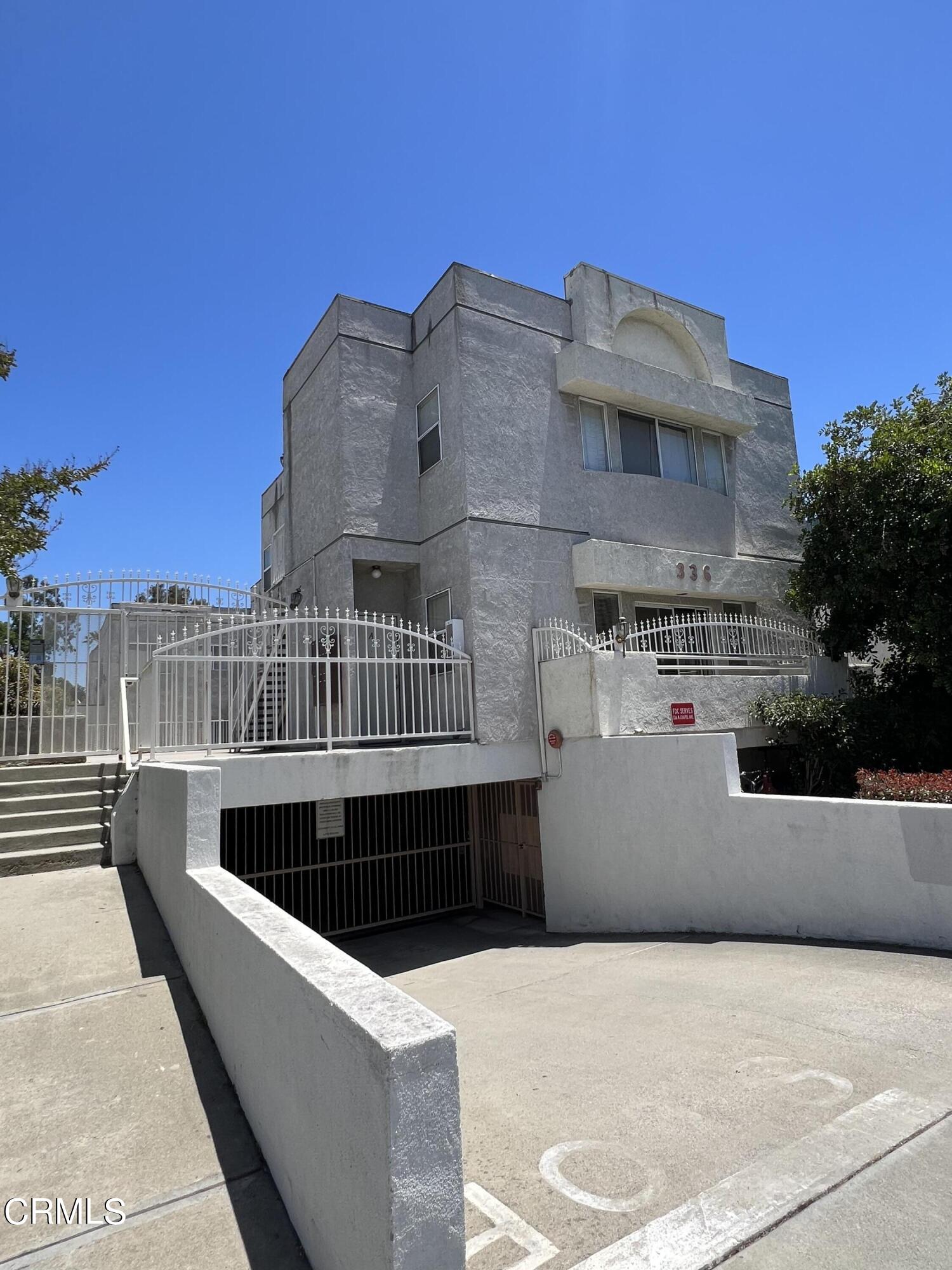 a view of roof deck with couches and sky view