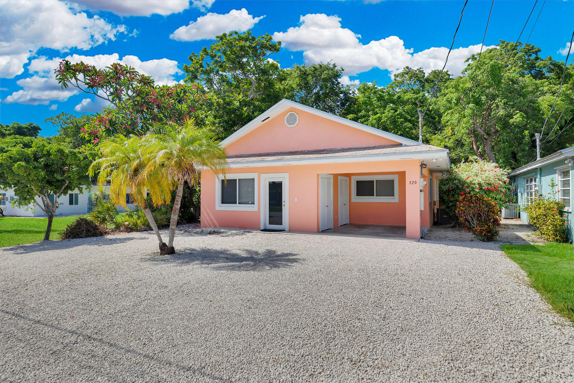 320 Sound Drive Key Largo, FL 33037 - Photo 16 of 48 a front view of a house with garden