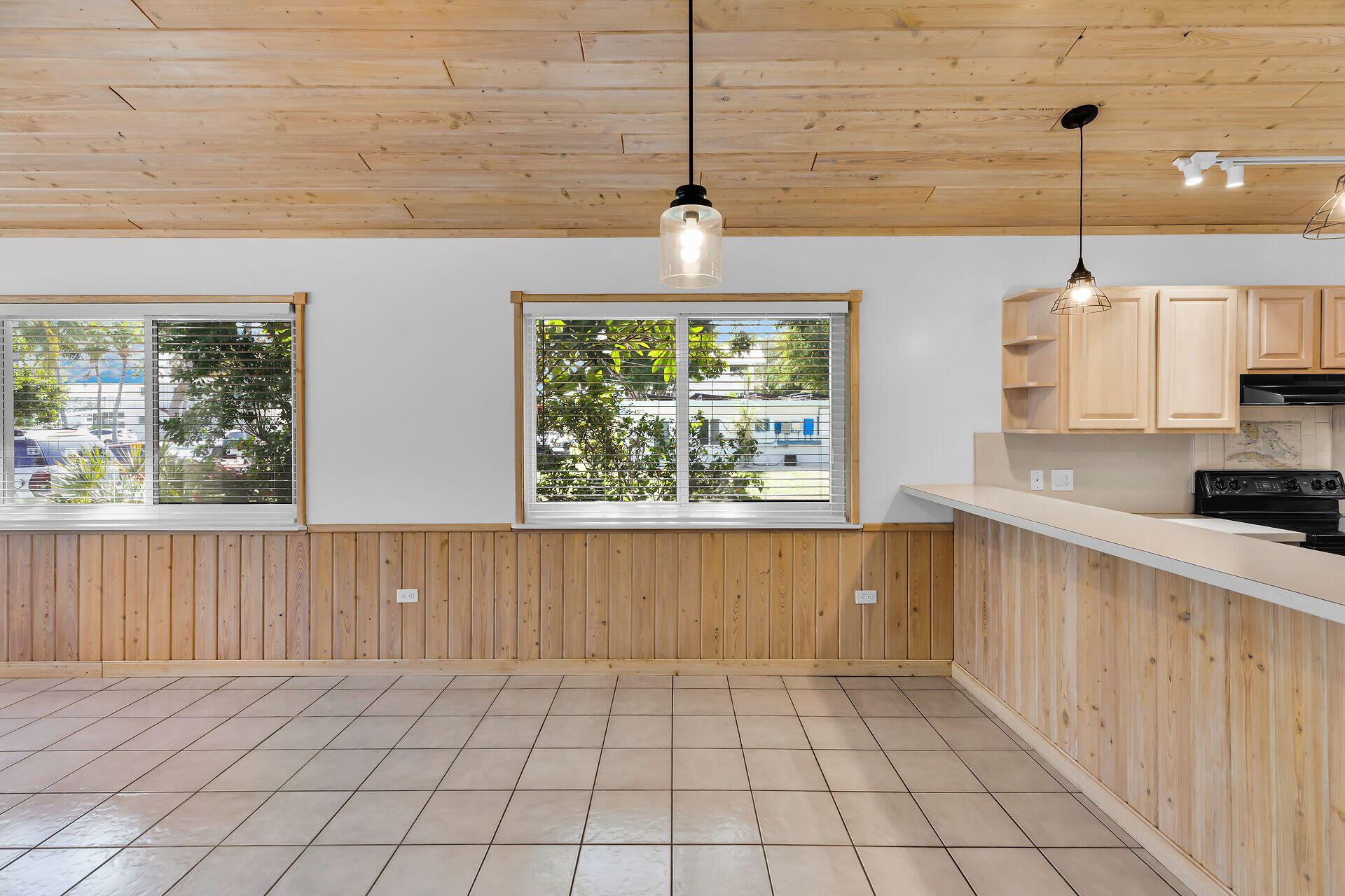 320 Sound Drive Key Largo, FL 33037 - Photo 22 of 48 a kitchen with stainless steel appliances a kitchen island wooden cabinets and a chandelier
