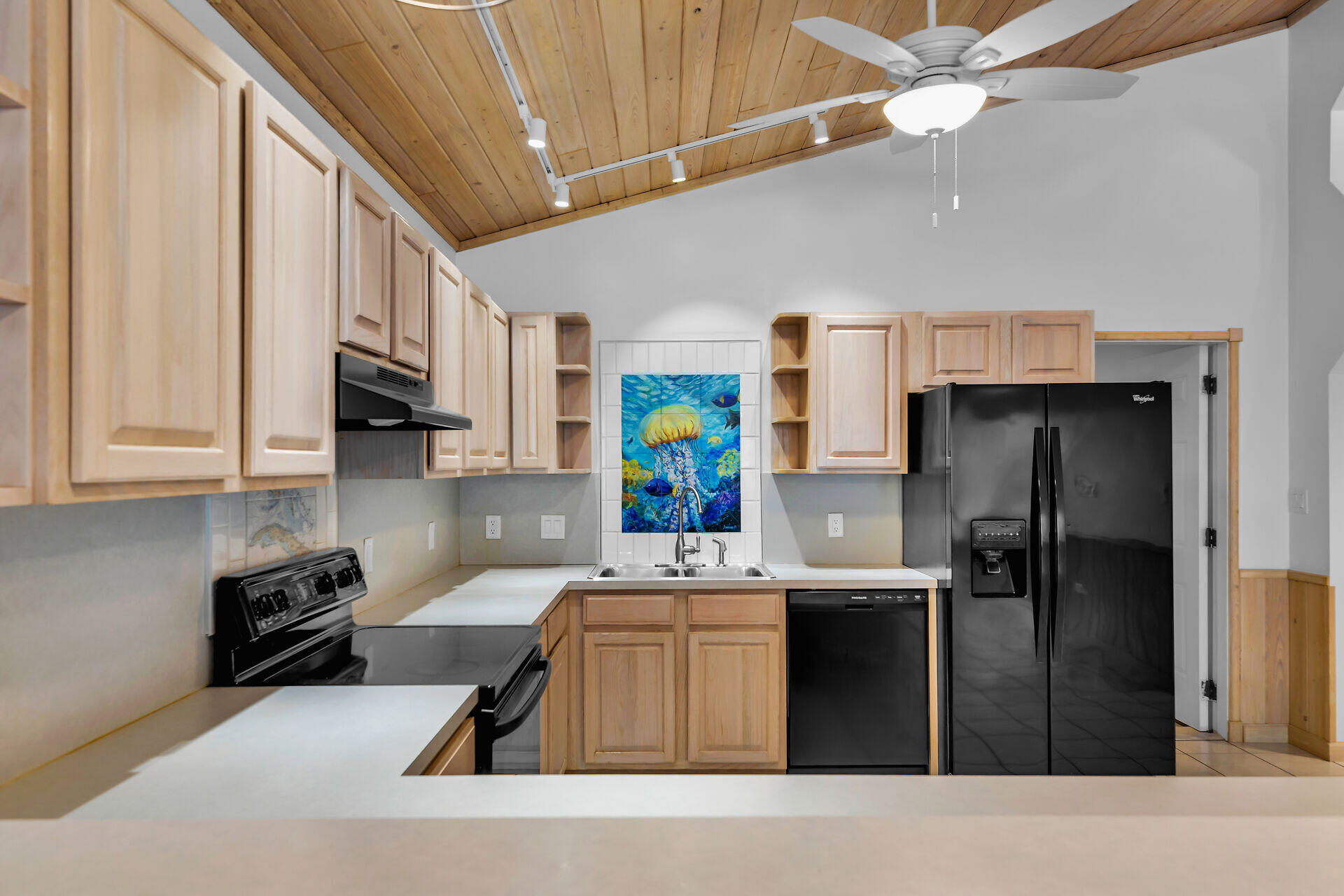 320 Sound Drive Key Largo, FL 33037 - Photo 25 of 48 a kitchen with stainless steel appliances kitchen island granite countertop a refrigerator oven a sink a stove and island